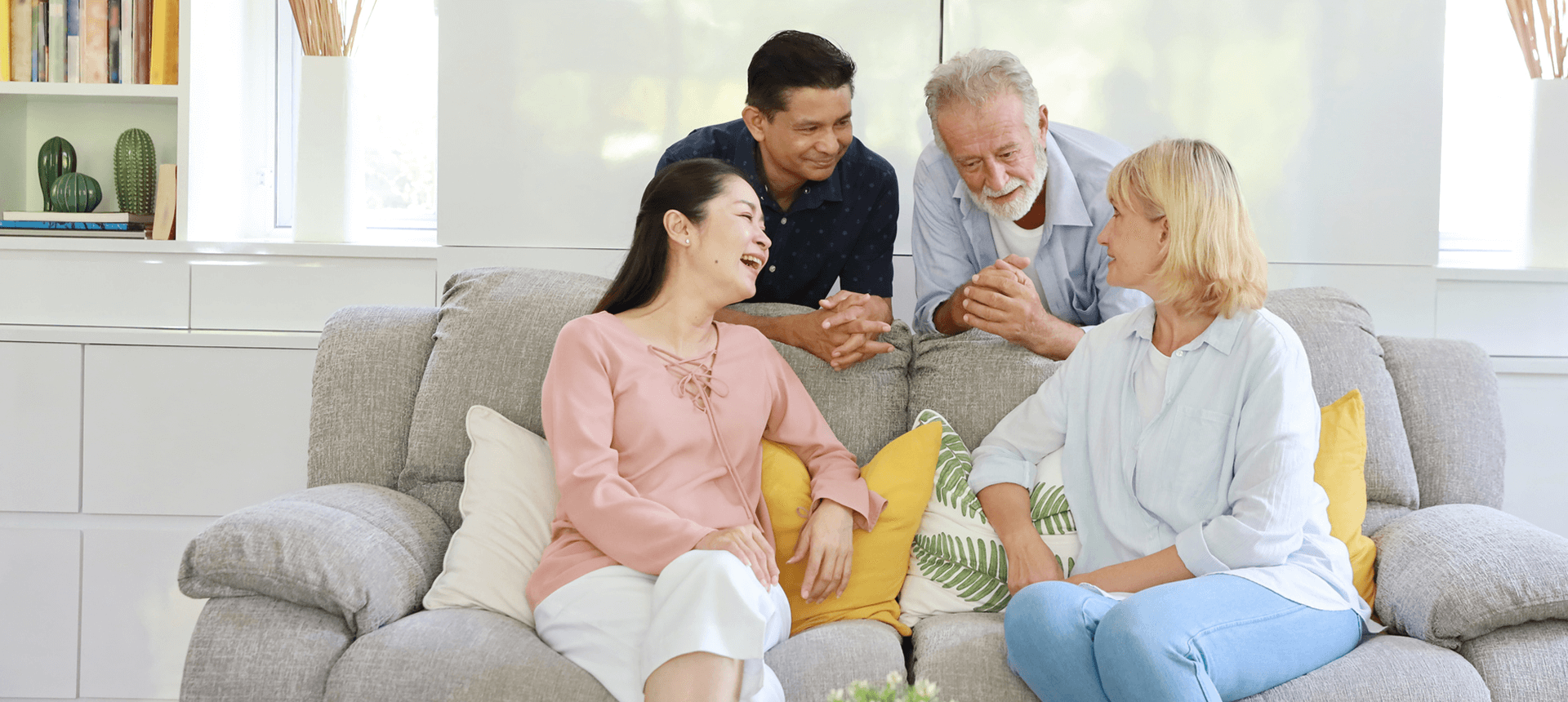 Happy friends chatting indoors