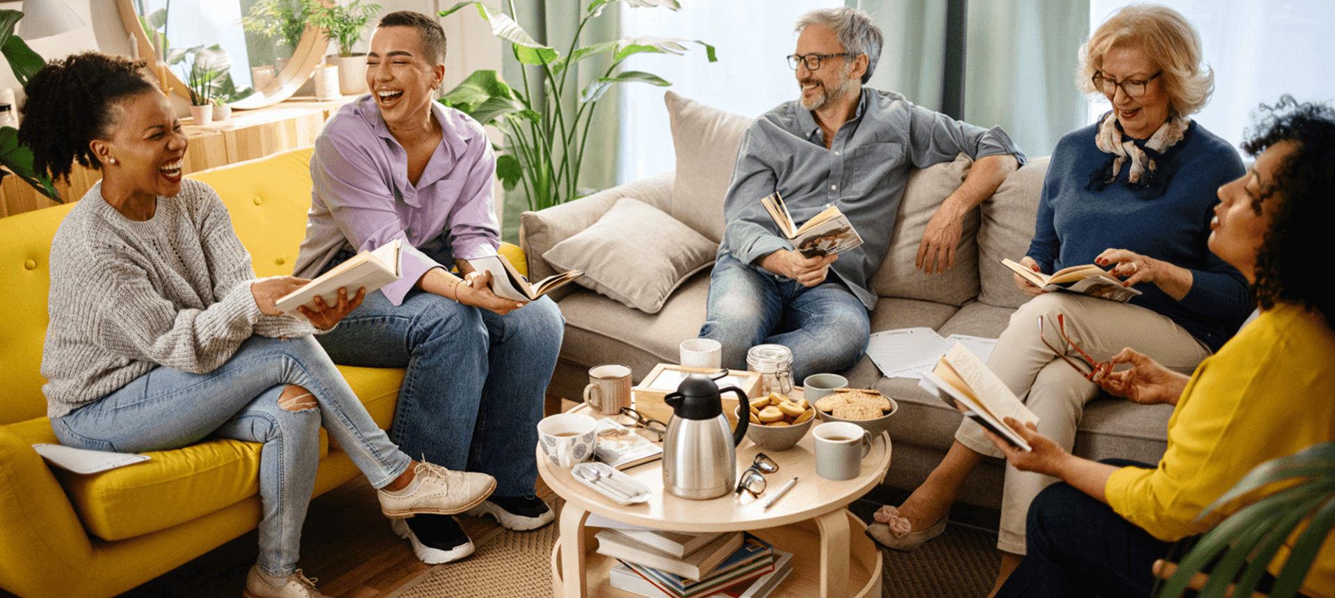 Group enjoying coffee and books at home